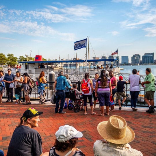 People gathered at Piers Park Sailing Center